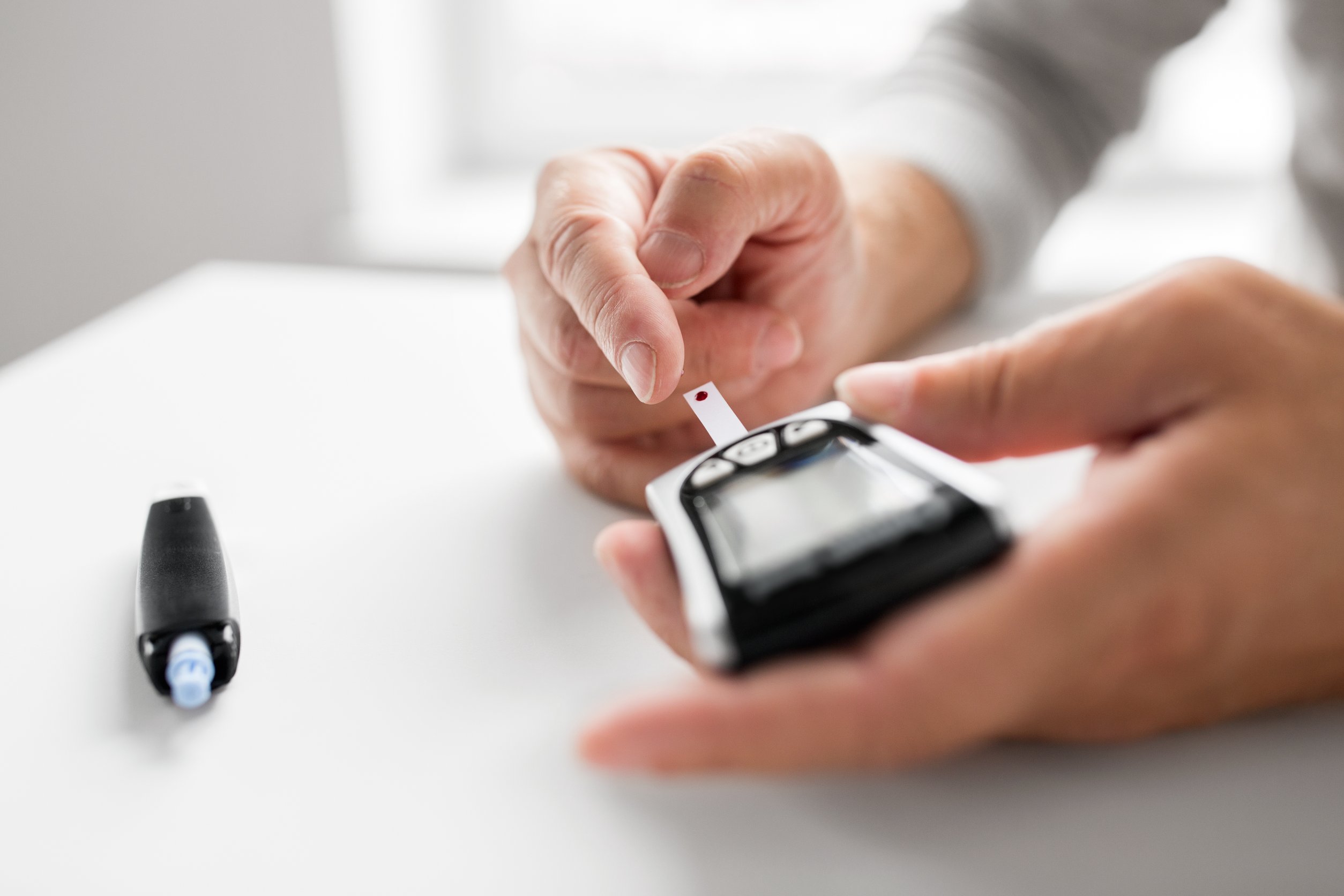 A person checking their blood sugar