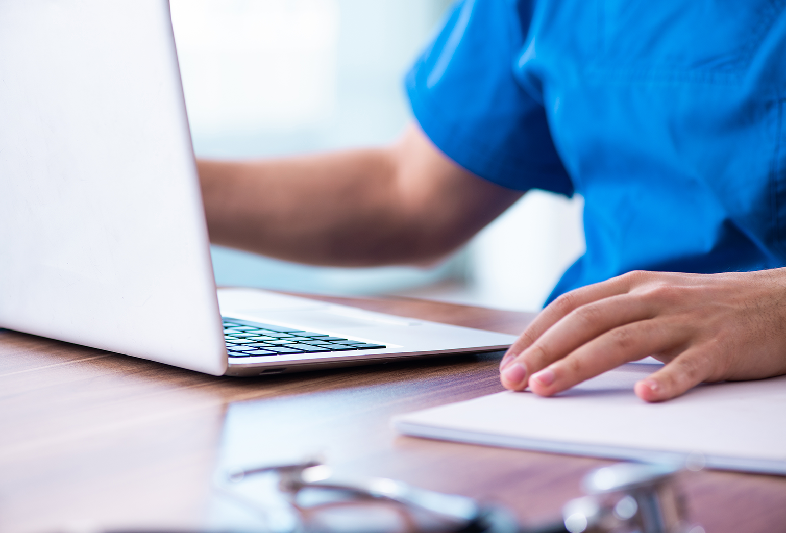 Person sitting in front of a laptop