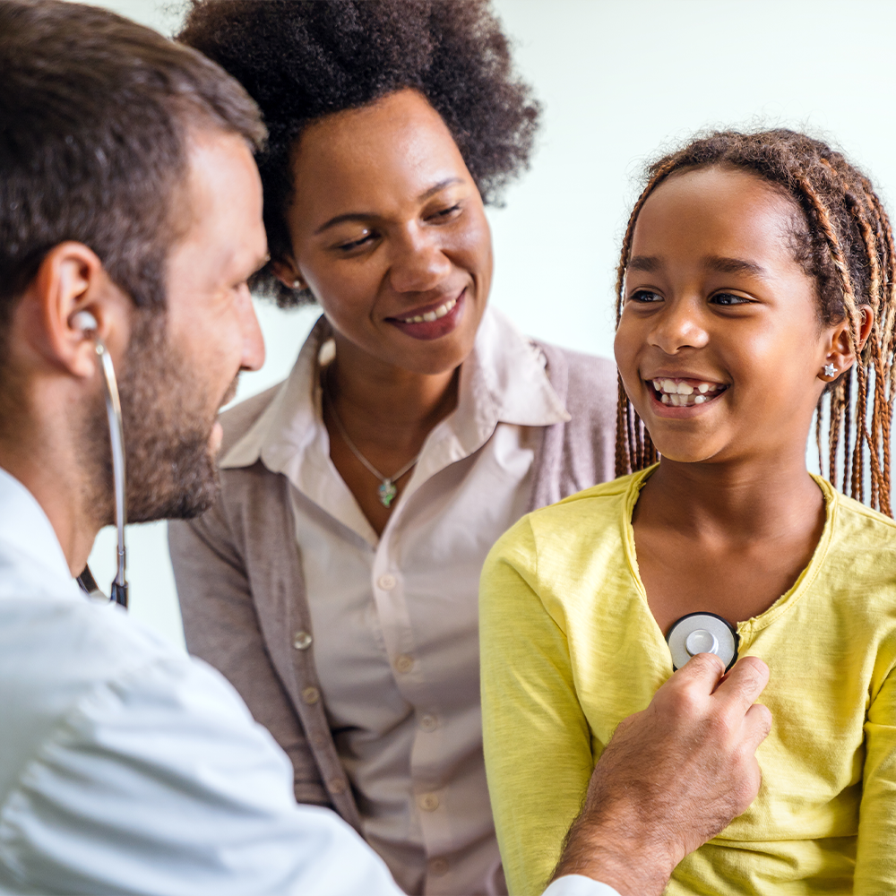 Pediatrician examining a child